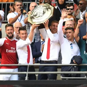 Arsenal Champions: Giroud, Koscielny, Mertesacker, Gabriel Celebrate FA Community Shield Victory Arsenal Champions: Giroud, Koscielny, Mertesacker, Gabriel Celebrate FA Community Shield Victory