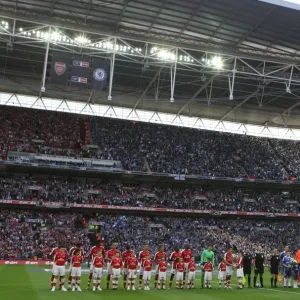 The Arsenal and Chelsea teams line up before the match