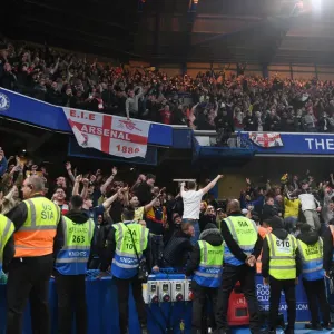 Arsenal Clinch Premier League Title at Stamford Bridge: Euphoric Fans Rejoice Over Chelsea Victory