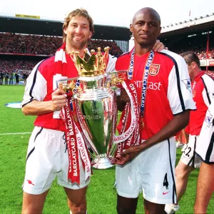 Arsenal cpatain Tony Adams and vice-captain Patrick Vieira lift the F. A