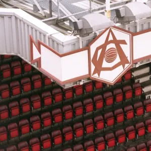 Arsenal Crest and seats, photographed from the North Bank