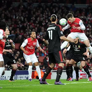 Arsenal Crushes AC Milan 3-0 in UEFA Champions League: Laurent Koscielny's Header Kicks Off the Victory