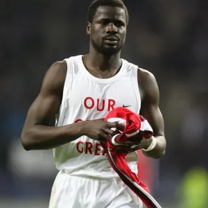 Arsenal defender Emmanuel Eboue throws his shirt to Arsenal defender Emmanuel Eboue throws his shirt to