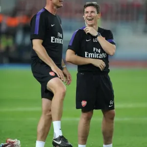 Arsenal Doctor Gary O Driscoll shares a joke with Steve Bould Arsenal Assistant Manager