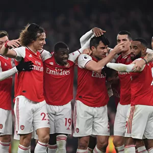 Arsenal Double Over Manchester United: Sokratis, Ozil, Luiz, Maitland-Niles, Aubameyang, Lacazette, and Xhaka Celebrate Glorious Victory (January 2020)