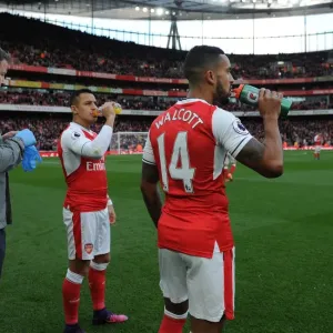 Arsenal Duo Theo Walcott and Alexis Sanchez Prepare for Kick-off Against Middlesbrough (2016-17) Arsenal Duo Theo Walcott and Alexis Sanchez Prepare for Kick-off Against Middlesbrough (2016-17)