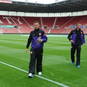 Arsenal Duo Thomas Vermaelen and Lukas Podolski Before Stoke City Clash (2012-13) Arsenal Duo Thomas Vermaelen and Lukas Podolski Before Stoke City Clash (2012-13)