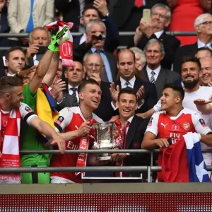 Arsenal FA Cup Victory: Per Mertesacker and Laurent Koscielny Celebrate with the Trophy after Beating Chelsea 2-1 Arsenal FA Cup Victory: Per Mertesacker and Laurent Koscielny Celebrate with the Trophy after Beating Chelsea 2-1