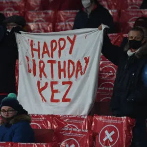 Arsenal Fans in Action: Cheering at Emirates Stadium during UEFA Europa League Match (Arsenal vs. SK Rapid Wien, 2020-21)