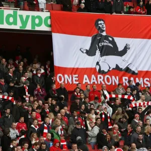 Arsenal fans have a banner supporting Aaron Ramsey who broke his leg in the previous match Arsenal fans have a banner supporting Aaron Ramsey who broke his leg in the previous match