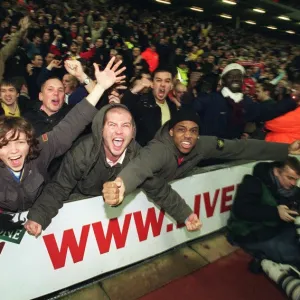 Arsenal fans celebrate the 3rd Arsenal goal scored by Thierry Henry