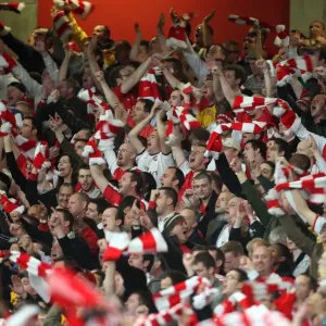 Arsenal fans celebrate the 3rd goal