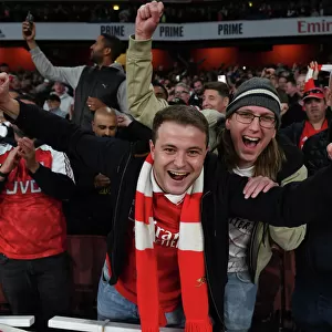 Arsenal Fans Celebrate Victory Over Liverpool in Premier League Clash at Emirates Stadium
