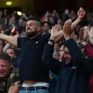 Arsenal fans celebrates Arsenals 3rd goal