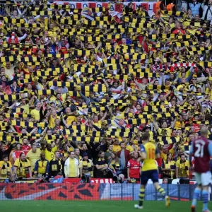Arsenal fans hold up there scarves during the match. Arsenal 4: 0 Aston Villa. FA Cup Final Arsenal fans hold up there scarves during the match. Arsenal 4: 0 Aston Villa. FA Cup Final