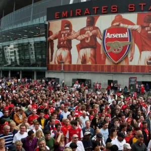 Arsenal fans leave the stadium after the the match