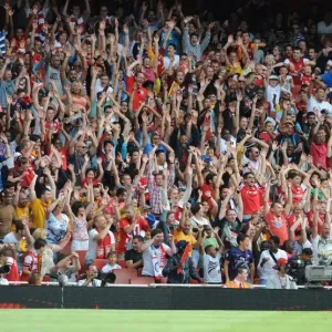 A Print of Arsenal Fans Performing a Mexican Wave at Emirates Stadium