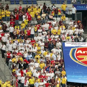 Arsenal fans near a giant Arsenal crest Arsenal fans near a giant Arsenal crest