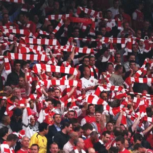 Arsenal fans with their scarves Arsenal fans with their scarves