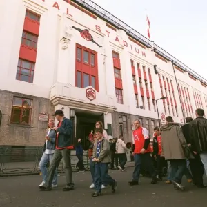 Arsenal fans walk outside the East Stand before the match