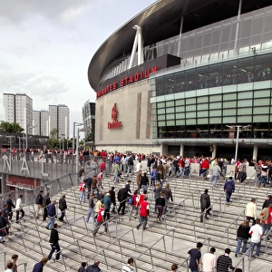 Arsenal fans walk up the the stadium before the match