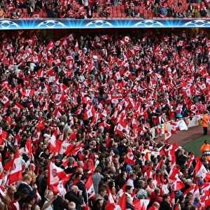 Arsenal fans wave their flags before the match