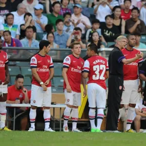 Arsenal FC: Arsene Wenger and Squad at Pre-Season Training in Hong Kong (2012) - Alex Song, Mikel Arteta, Thomas Eisfeld, Nico Yennaris, and Kyle Bartley Arsenal FC: Arsene Wenger and Squad at Pre-Season Training in Hong Kong (2012) - Alex Song, Mikel Arteta, Thomas Eisfeld, Nico Yennaris, and Kyle Bartley