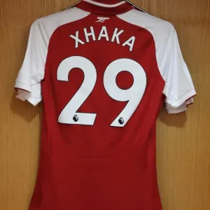 Arsenal FC: Granit Xhaka's Jersey in Arsenal Changing Room Before Arsenal vs Leicester City (2017-18) Arsenal FC: Granit Xhaka's Jersey in Arsenal Changing Room Before Arsenal vs Leicester City (2017-18)