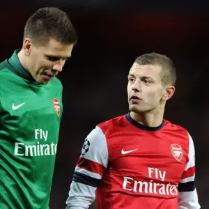 Arsenal FC: Jack Wilshere and Wojciech Szczesny in Deep Conversation After Arsenal v Montpellier UEFA Champions League Match (2012-13)