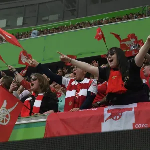 Arsenal FC: Passionate Fans Unwavering Support at the 2022-23 UEFA Women's Champions League Semifinal vs. VfL Wolfsburg