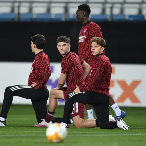 Arsenal FC Players Kieran Tierney and Ben Cottrell Warm Up Ahead of Molde FK Clash in UEFA Europa League