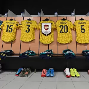 Arsenal FC: United in the Huddle - Preparing for Battle against Vitoria Guimaraes in the Europa League