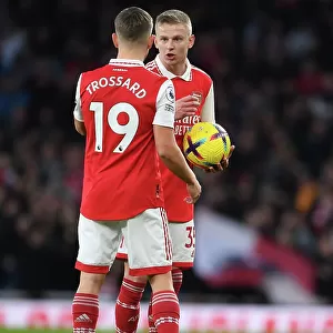 Arsenal FC vs Brentford FC: Trossard and Zinchenko in Action during the 2022-23 Premier League Clash at Emirates Stadium