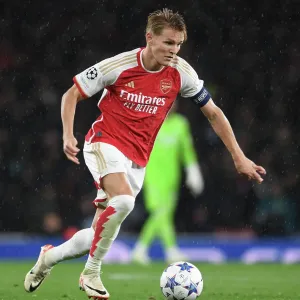 Arsenal FC vs PSV Eindhoven: Champions League Clash - Martin Odegaard in Action