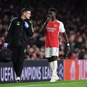 Arsenal FC vs Sevilla FC: Bukayo Saka Receives Medical Attention in Group B - UEFA Champions League 2023/24