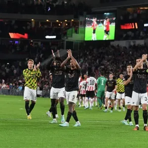 Arsenal Football Club Unites with Fans in Europa League Victory Celebration vs. PSV Eindhoven