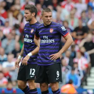 Arsenal Forwards Olivier Giroud and Lukas Podolski in Action at Stoke City (2012-13) Arsenal Forwards Olivier Giroud and Lukas Podolski in Action at Stoke City (2012-13)