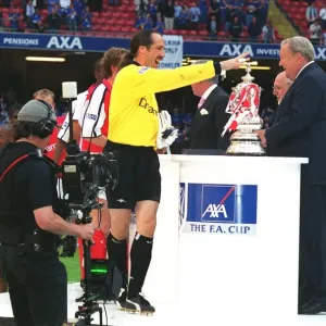 Arsenal goalkeeper David Seaman collects his medal from Leonart Johanssen Arsenal goalkeeper David Seaman collects his medal from Leonart Johanssen