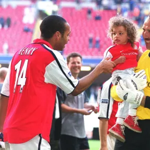 Arsenal goalkeeper David Seaman with daughter Georgina and Thierry Henry after the match