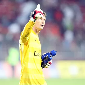 Arsenal goalkeeper Jens Lehmann waves to the fans after the match