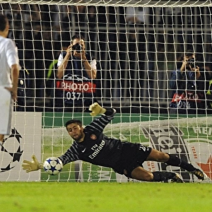 Arsenal goalkeeper Lucasz Fabianski saves the penalty from Cleo (Partizan)