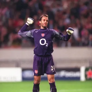Arsenal goalkeeper Manuel Almunia celebrates after the match