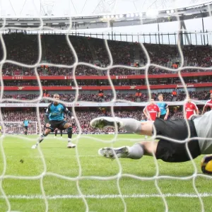 Arsenal goalkeeper Manuel Almunia save a penalty from Ashley Young