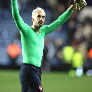 Arsenal goalkeeper Manuel Amunia salutes the fans after the match