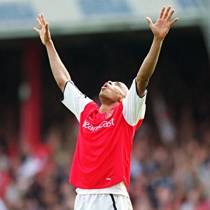 Arsenal golden boot winner Thierry Henry celebrates at the final whistle