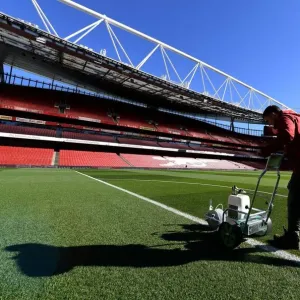 Arsenal Groundsman Meticulously Prepares Emirates Stadium Pitch for Carabao Cup Match