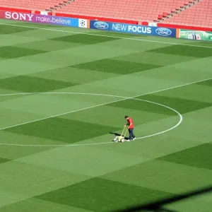 Arsenal Groundsman Paul Ashcroft marks out the pitch before a match, Print Arsenal Groundsman Paul Ashcroft marks out the pitch before a match, Print