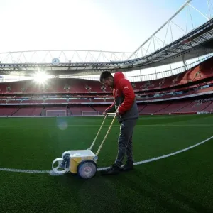 Arsenal Groundsman Prepares Emirates Stadium Pitch for Arsenal vs West Bromwich Albion (2016-17)