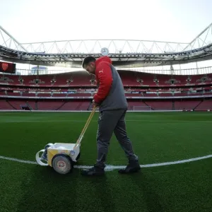 Arsenal Groundsman Prepares Emirates Stadium Pitch for Arsenal vs West Bromwich Albion (2016-17)