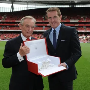 Arsenal Honors Retired Jockey AP McCoy with Silver Cannon at Arsenal vs. West Bromwich Albion Match Arsenal Honors Retired Jockey AP McCoy with Silver Cannon at Arsenal vs. West Bromwich Albion Match